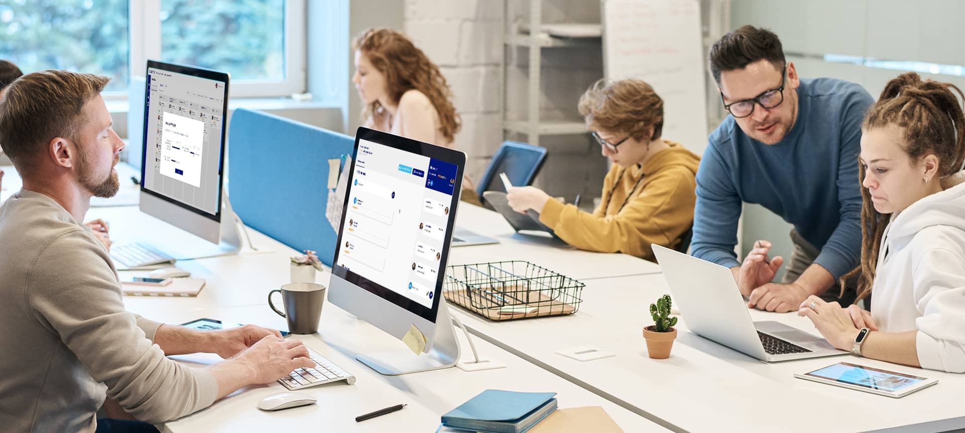 An HR team using recruitment software together