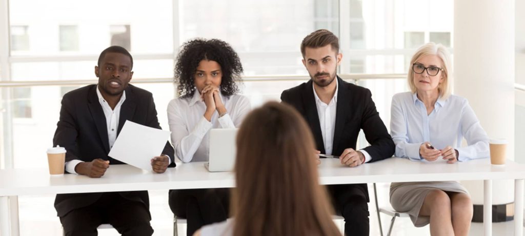 4 recruiters asking a candidate personality interview questions