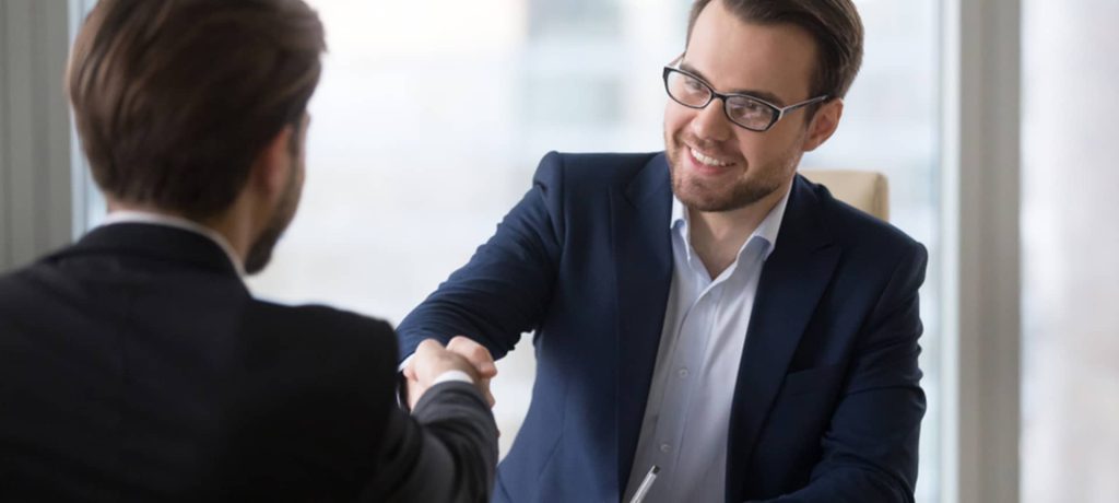 A recruiter and a candidate shaking hands