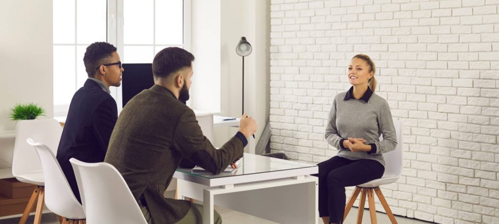 Two male recruiters working to improve the candidate experience