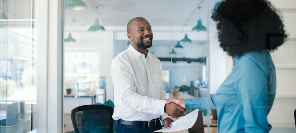 A male candidate accepting a job offer due to a great candidate experience