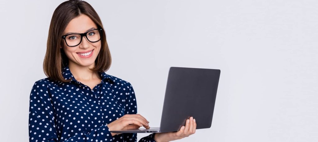 A picture showing a female candidate holding a black laptop