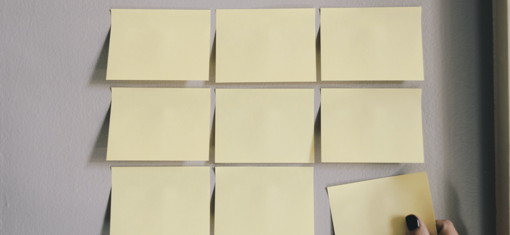 An image of sticky notes for assessment being lined together