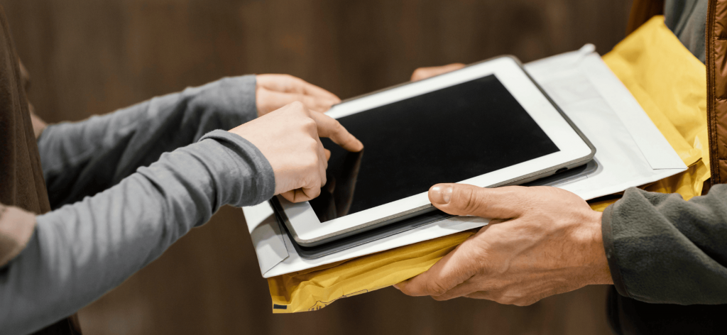 An image of a person touching a tablet screen 