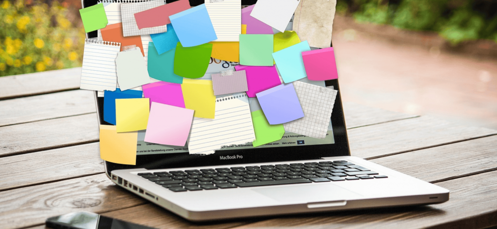 An image of a laptop screen filled with sticky notes 