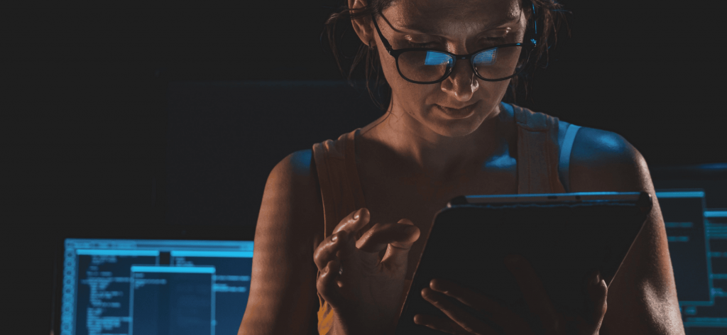 An image of a woman trying to overcome the challenges of onboarding by using HR onboarding software