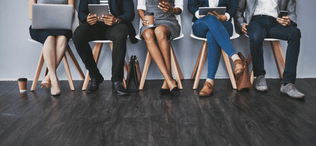 An image of potential hires waiting for a group talent assessment 