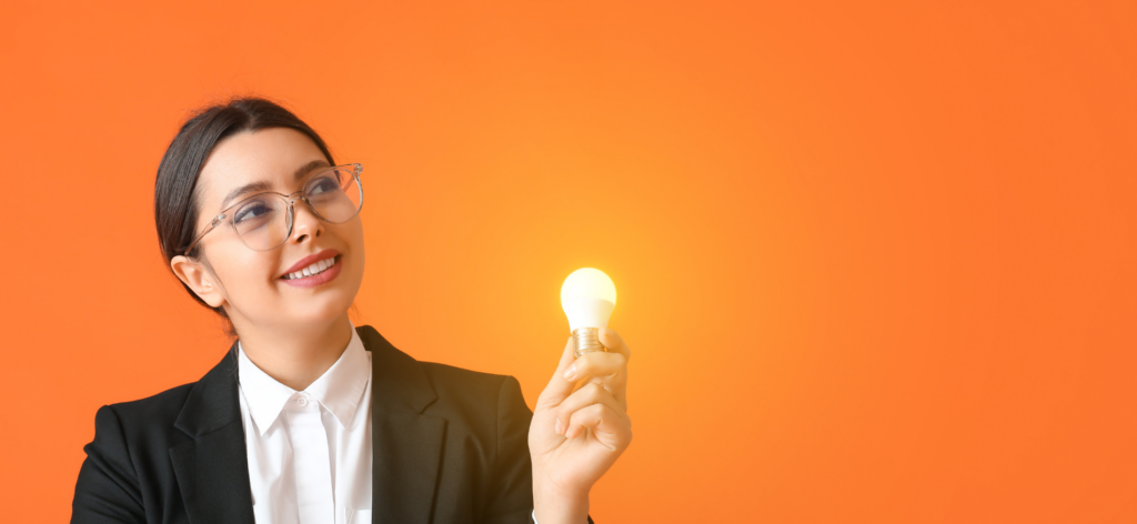 An image of a woman holding a bulb 