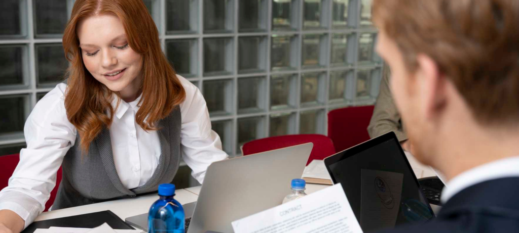 Two managers looking for the latest workplace trends in 2024