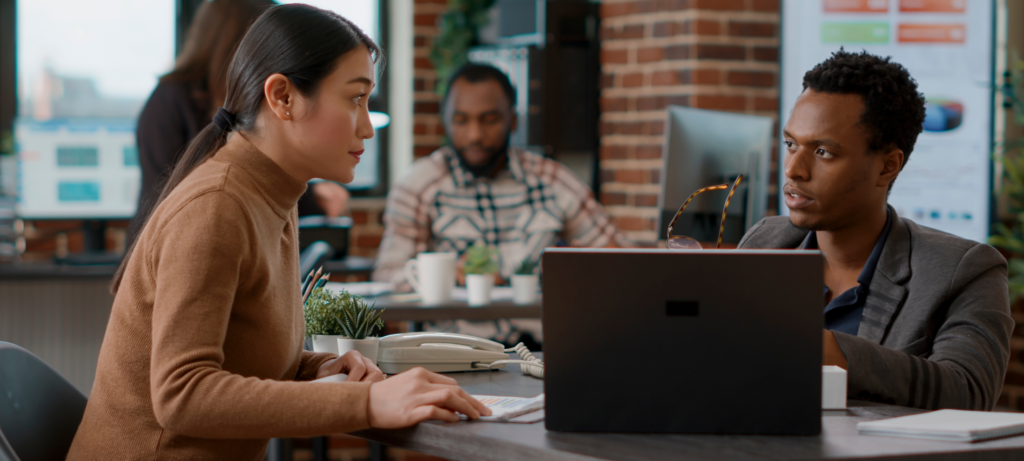 Two managers discussing the new hires onboarding 