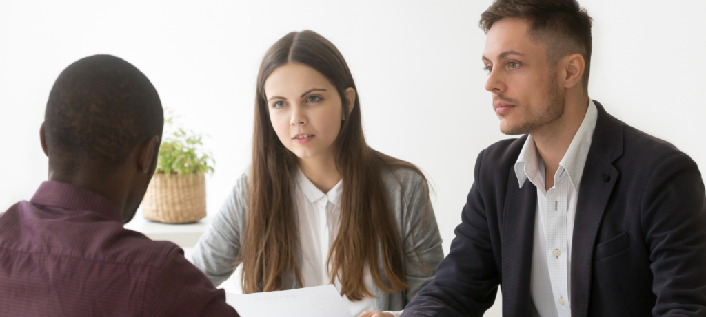 A team discussing measuring recruiter performance metrics