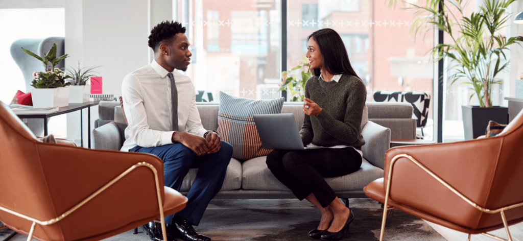 An image of HR professionals discussing job application tracking strategies