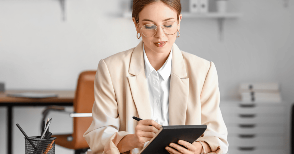 How to Use Hiring Analytics with EVA-REC To Track Your Recruiting Success | Elevatus An image of a recruiter leveraging hiring analytics tools during a recruitment strategy meeting.