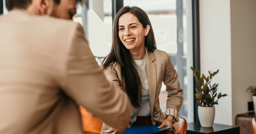 5 Innovative Hiring Tactics to Outpace Competitors & Save Over $50K | Elevatus An image of a diverse team of HR professionals collaborating on a digital hiring platform, showcasing innovative hiring strategies.