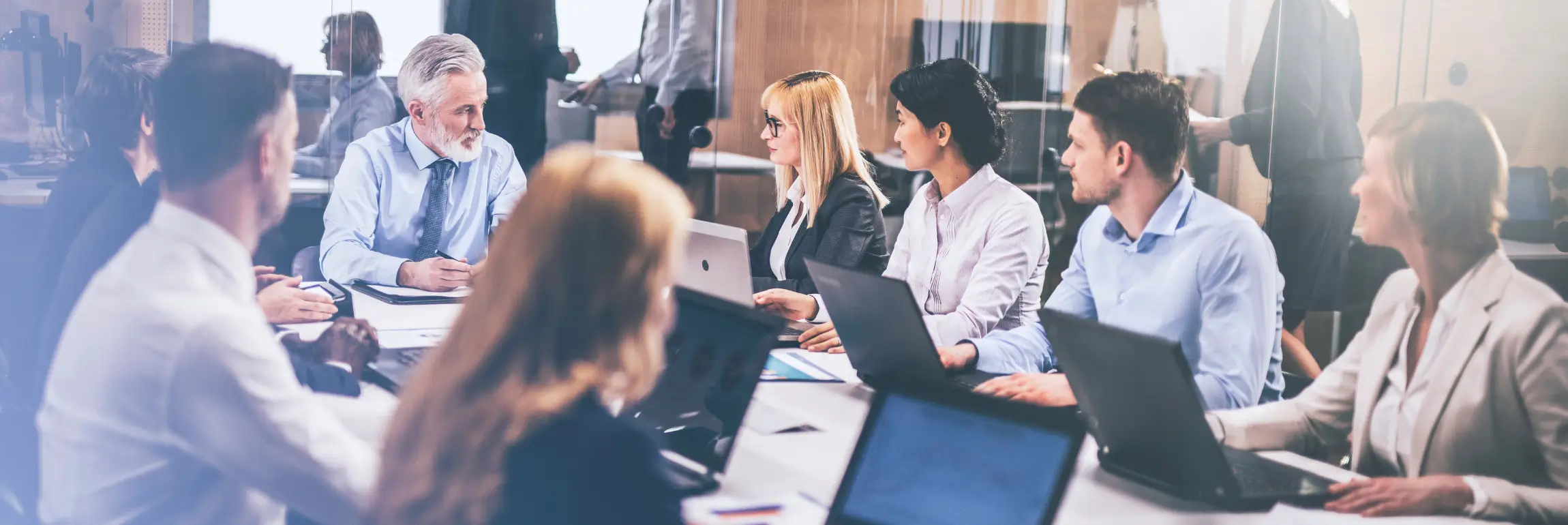An image of the hiring process in action with an HR team collaborating on a candidate selection.
