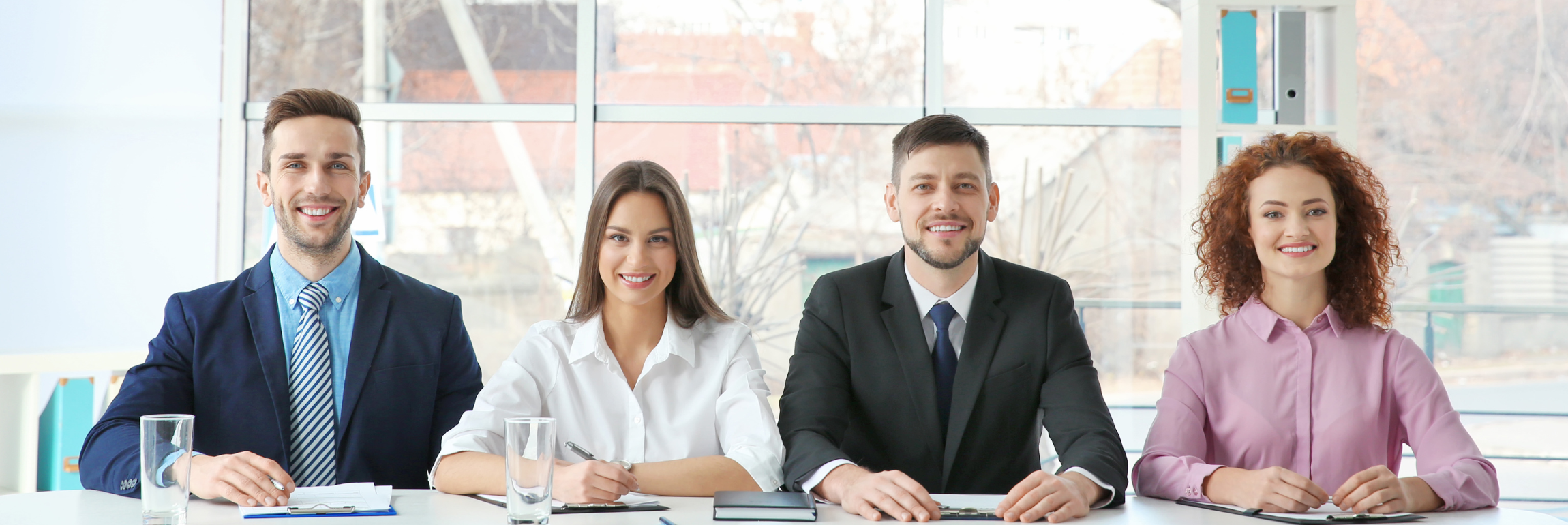 An image of a competency-based interviews panel evaluating a job applicant’s problem-solving abilities.
