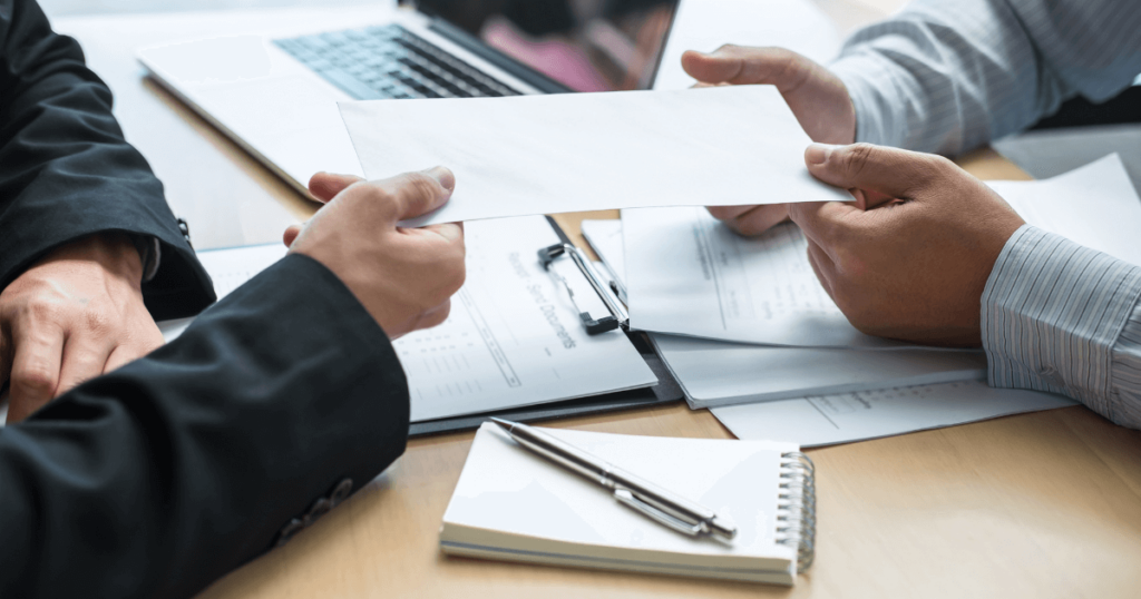 An image of a recruiter analyzing applicant data through old methods. 
