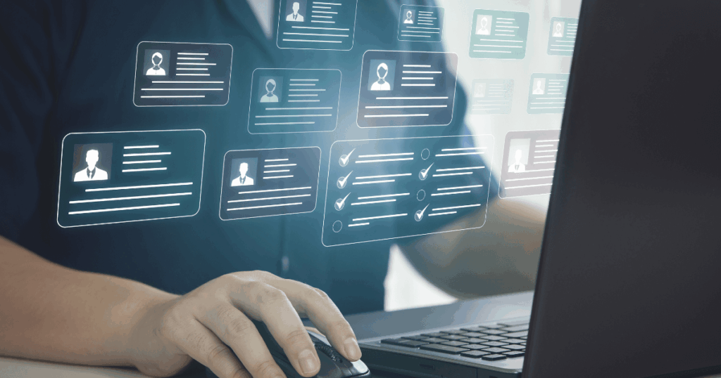 An image of a hiring manager reviewing a resume during a job interview.

