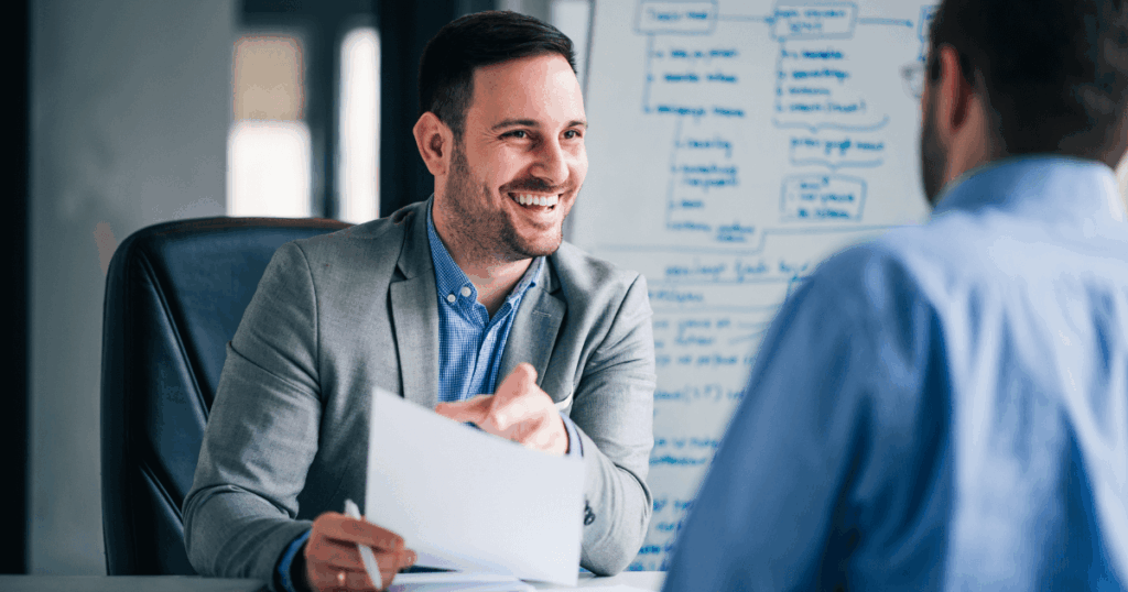 An image of a manager reviewing a chart showing 360 degree feedback advantages and disadvantages
