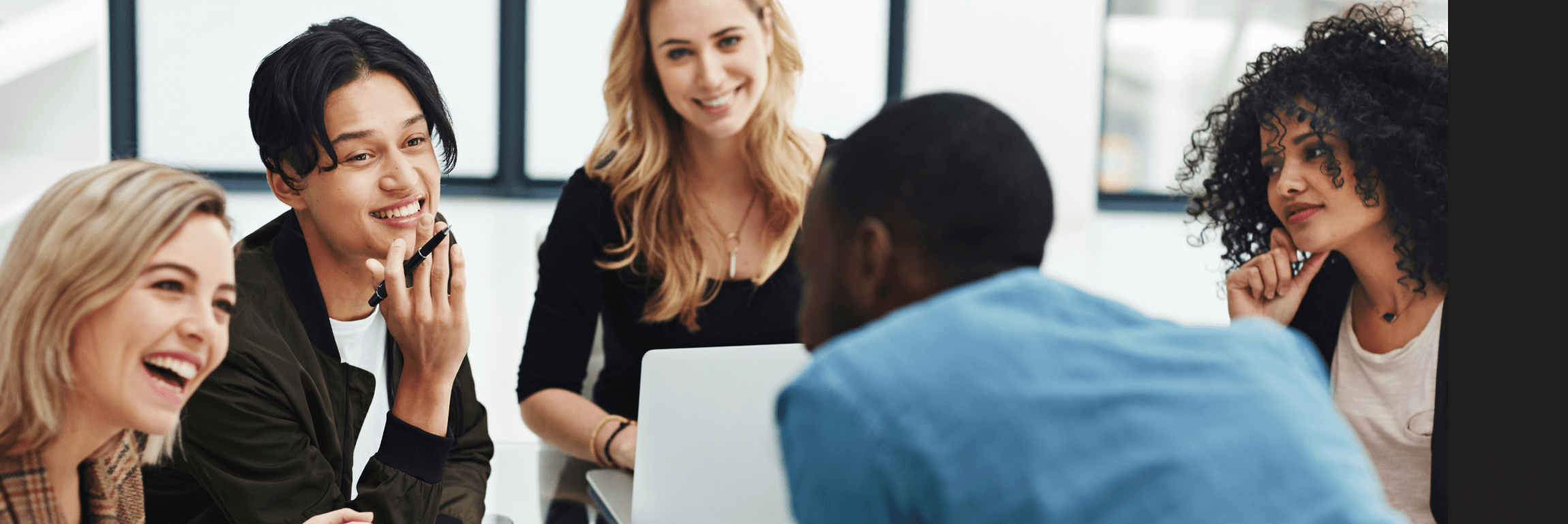 HR staff using a recruitment system on a computer screen.