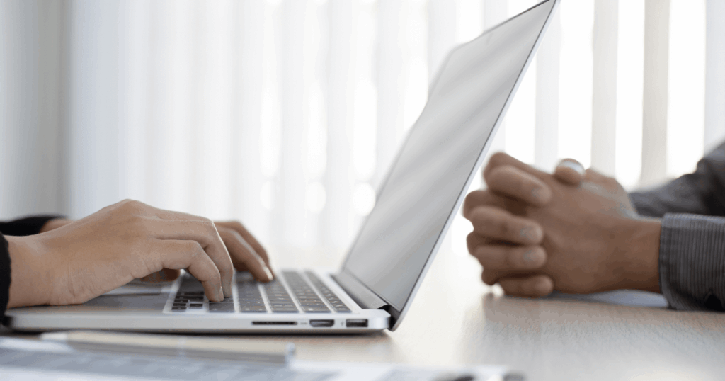 recruitment and selection workflow shown on a laptop.