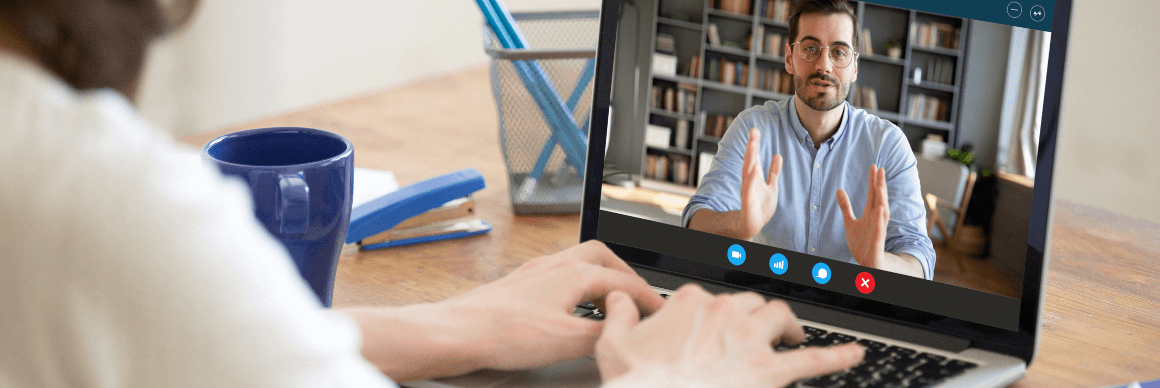 A recruiter using video interview solutions on a laptop