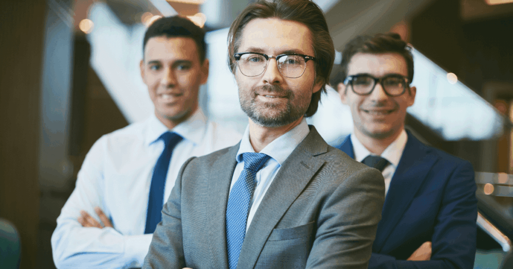 An image of HR professionals discussing interview questions regarding personality in a modern meeting room.