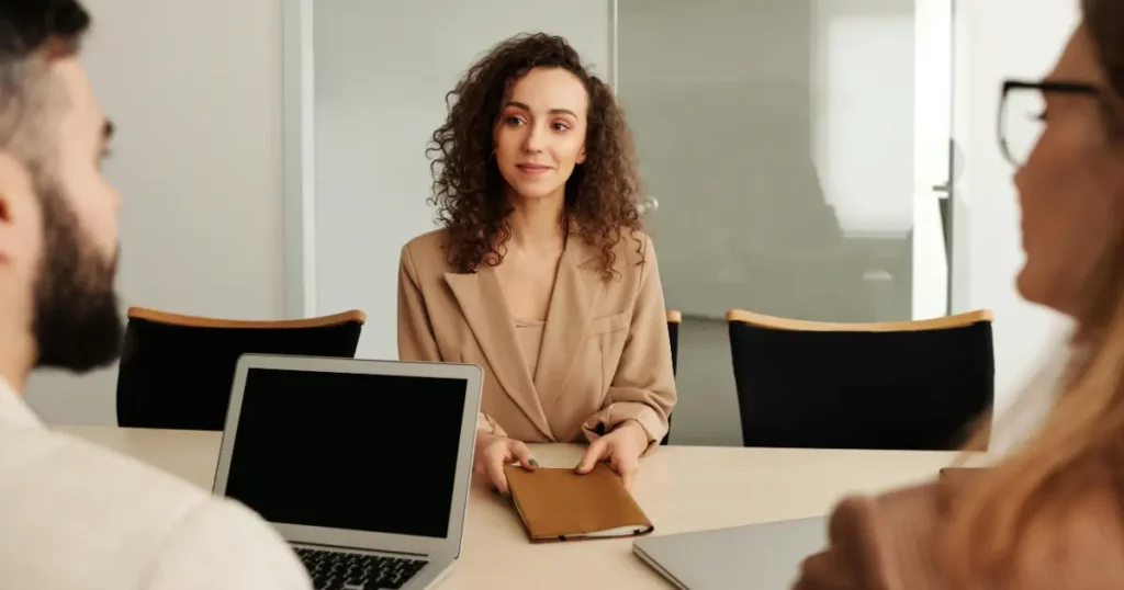 An image of an HR manager evaluating quality of hire data on a tablet
